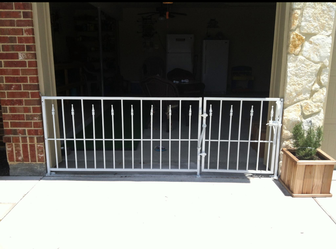 White steel security gate with spear-point pickets